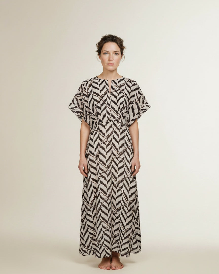 Full body view of the model wearing Co'couture Memphiscc Dress Off White