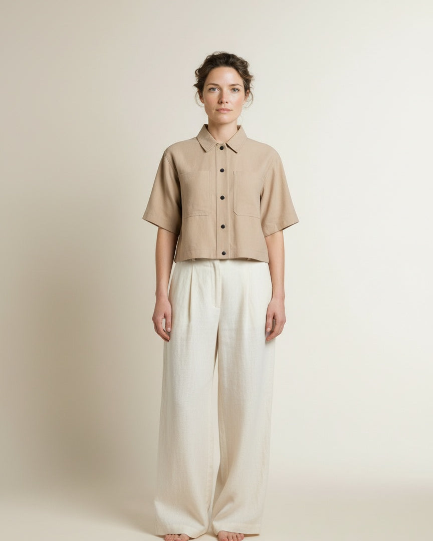 Full body view of the model wearing Aaiko Vanessa Ray 560 Blouses Sand