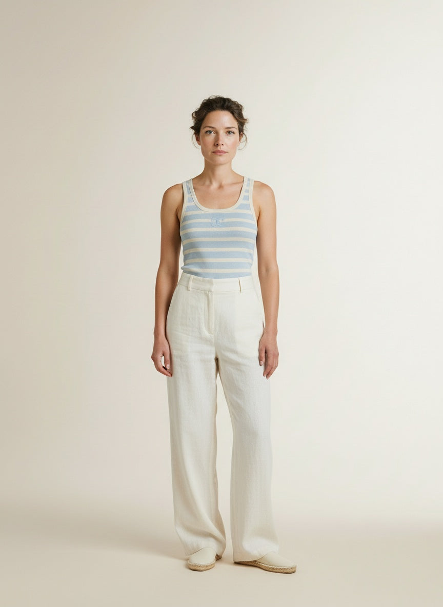 Full body view of the model wearing Co'couture Grannycc Rib Emb. Tank Top Offwhite/paleblue