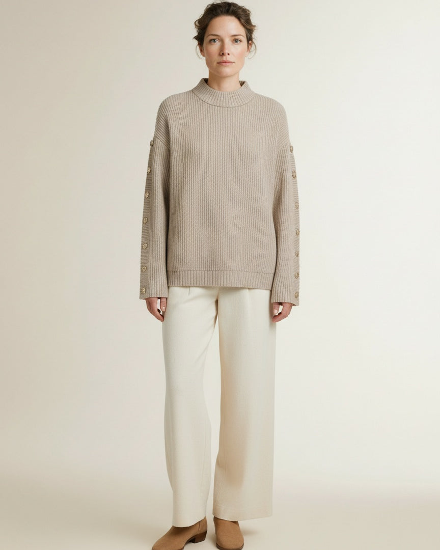 Full body view of the model wearing Co'couture Rowcc Button Sleeve Knit Bone