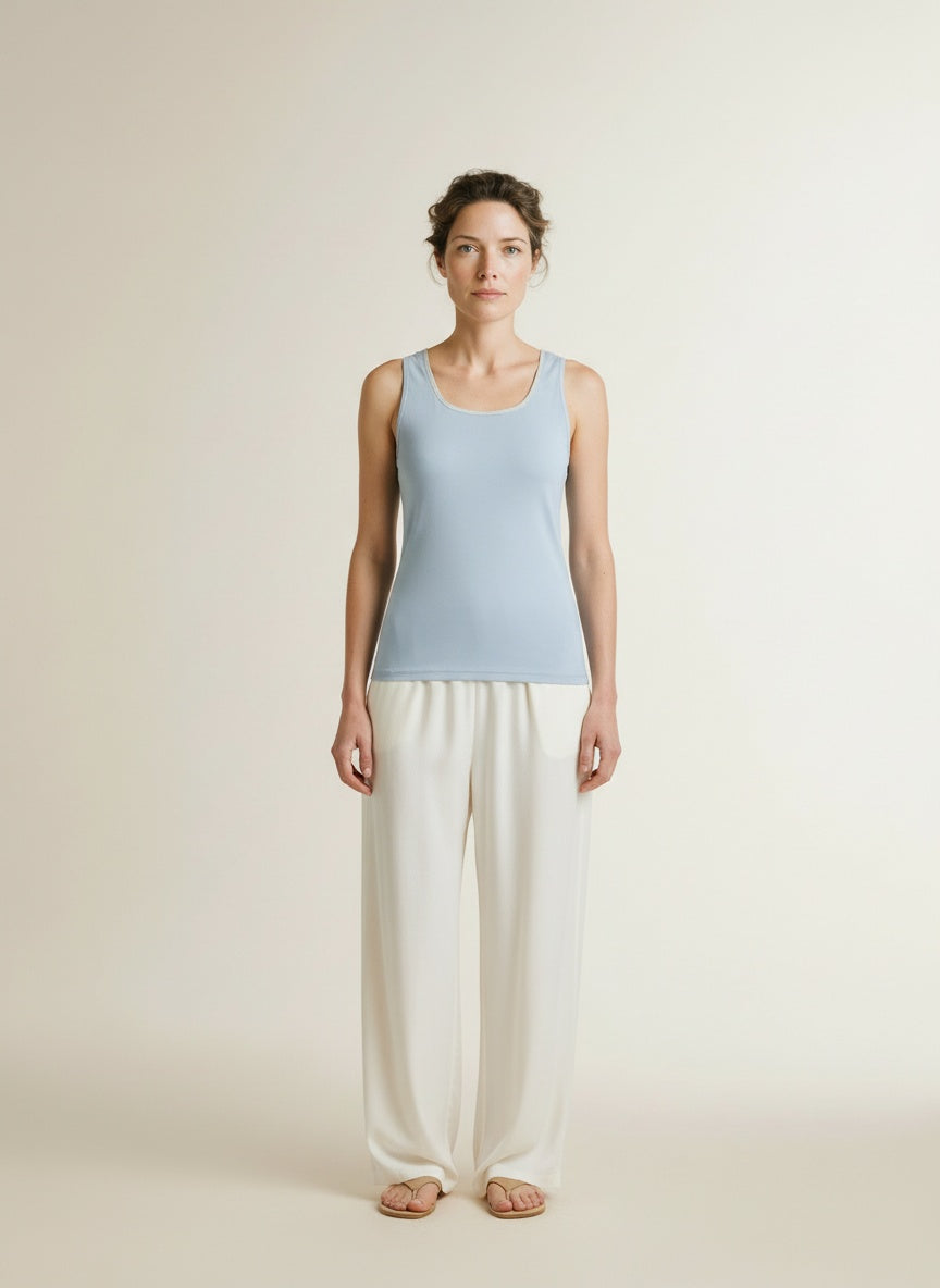 Full body view of the model wearing Nukus Juba Singlet 247 Sky/silver