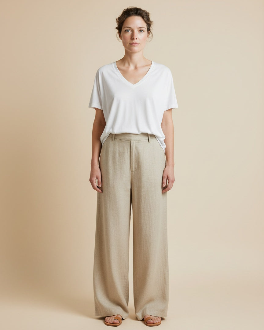 Full body view of the model wearing Msch Copenhagen Mschfenya Modal V Neck Tee Bright White