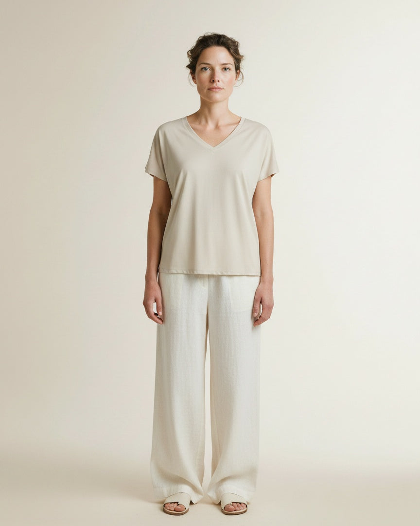Full body view of the model wearing Msch Copenhagen Mschfenya Modal V Neck Tee Oatmeal