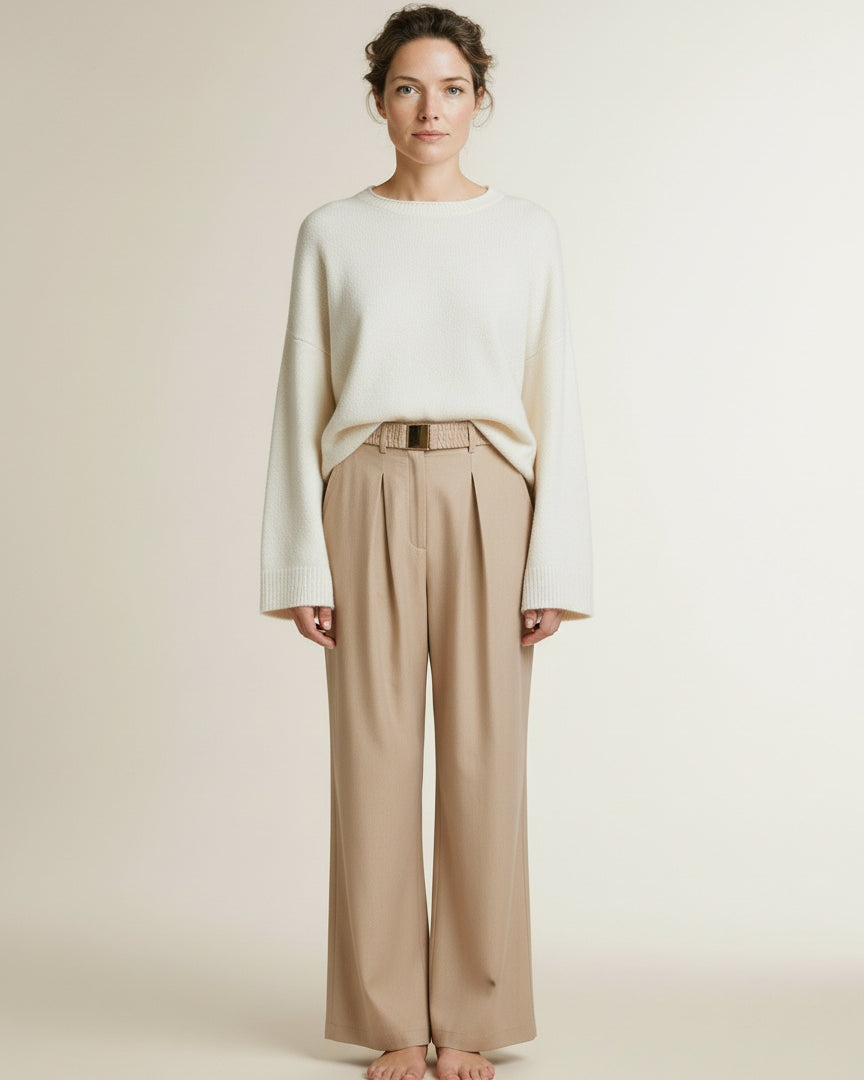 Full body view of the model wearing Aaiko Lotty Fringed Ray 560 Trousers Sand