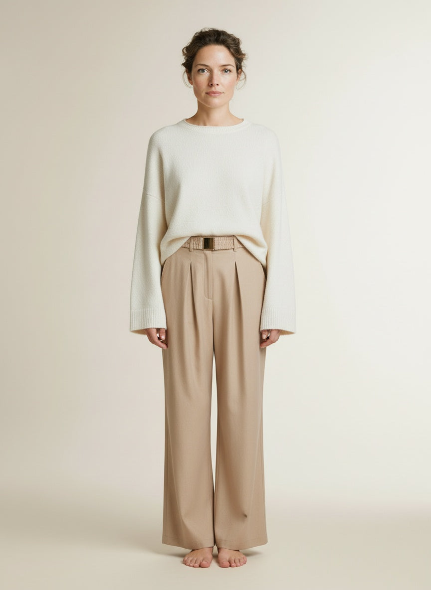 Full body view of the model wearing Aaiko Lotty Fringed Ray 560 Trousers Sand