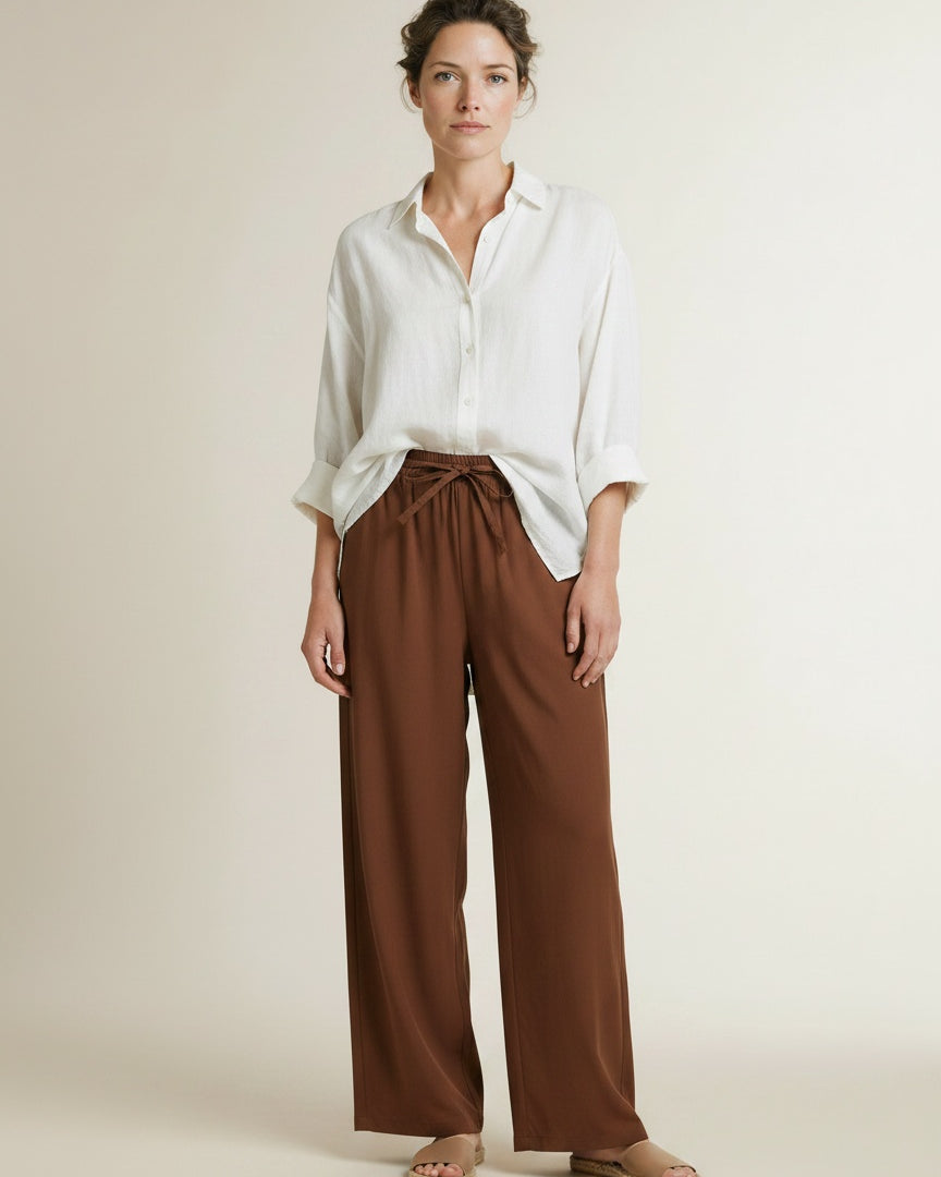 Full body view of the model wearing Co'couture Elaracc Ll Pant Suntan