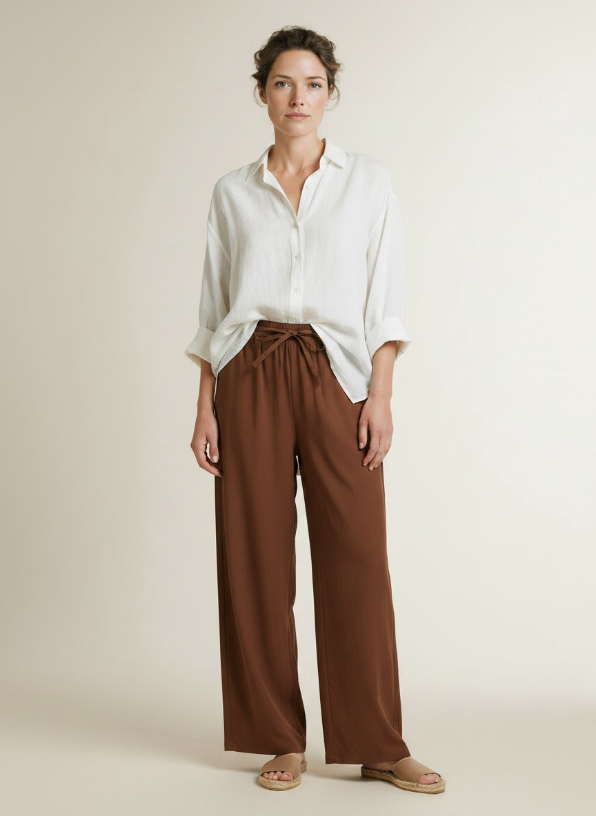 Full body view of the model wearing Co'couture Elaracc Ll Pant Suntan