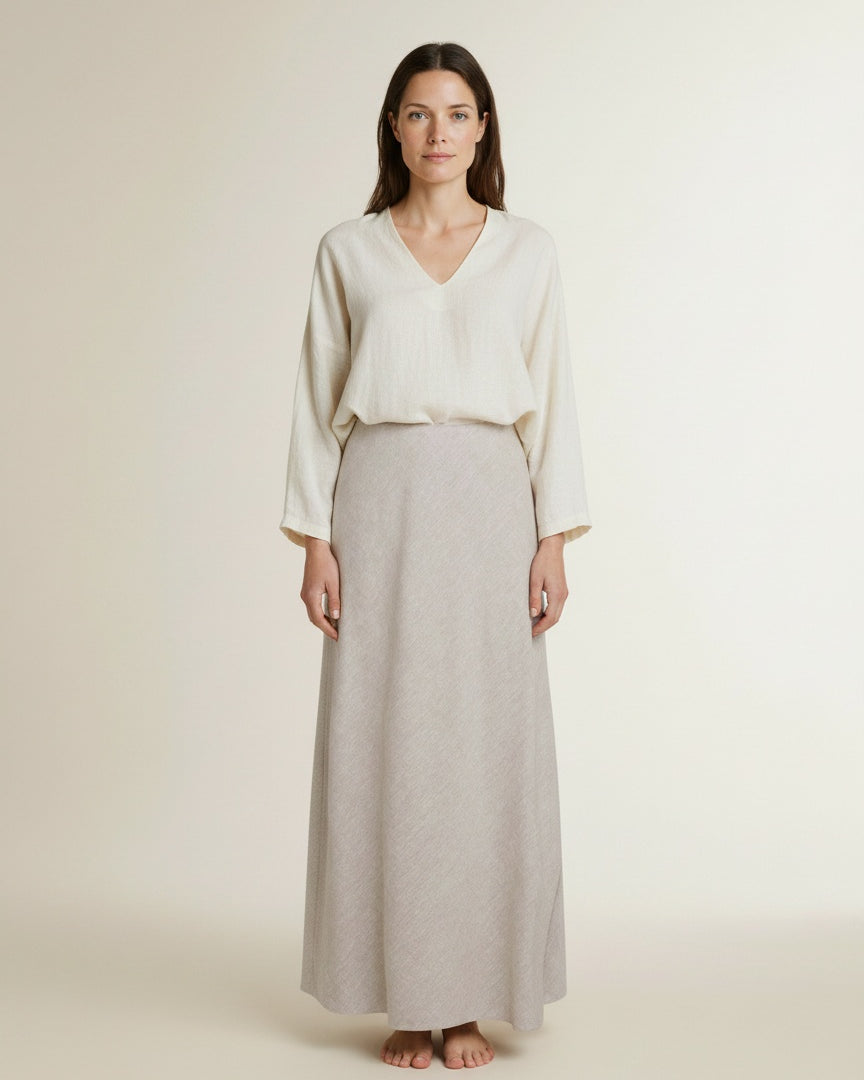 Full body view of the model wearing Msch Copenhagen Mschviana Ginia Skirt Sand Melange