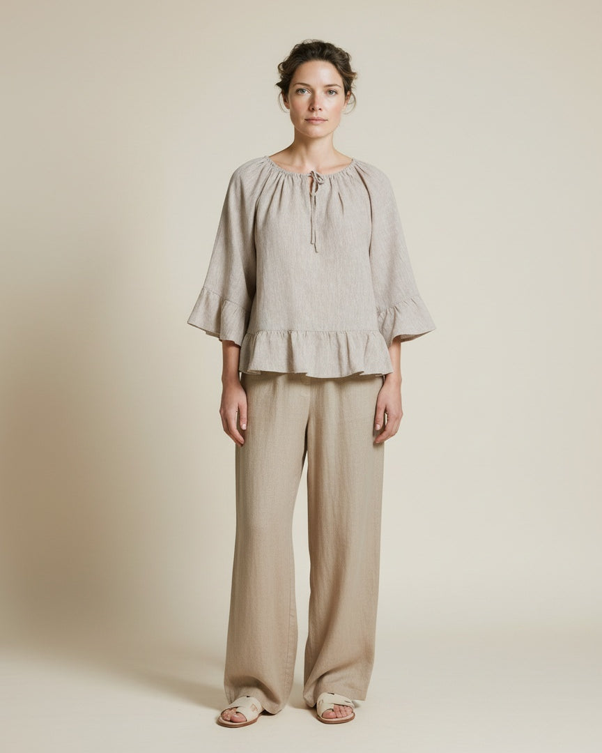 Full body view of the model wearing Msch Copenhagen Mschviana Ginia 2 4 Top Sand Melange