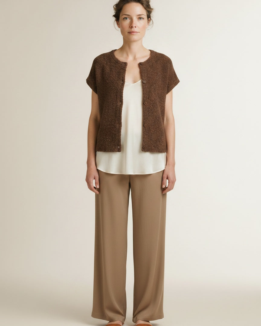 Full body view of the model wearing Red Button Sleeveless Knit Boucle Mud
