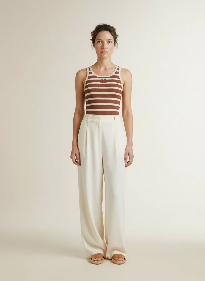 Full body view of the model wearing Co'couture Grannycc Rib Emb. Tank Top Offwhite/suntan