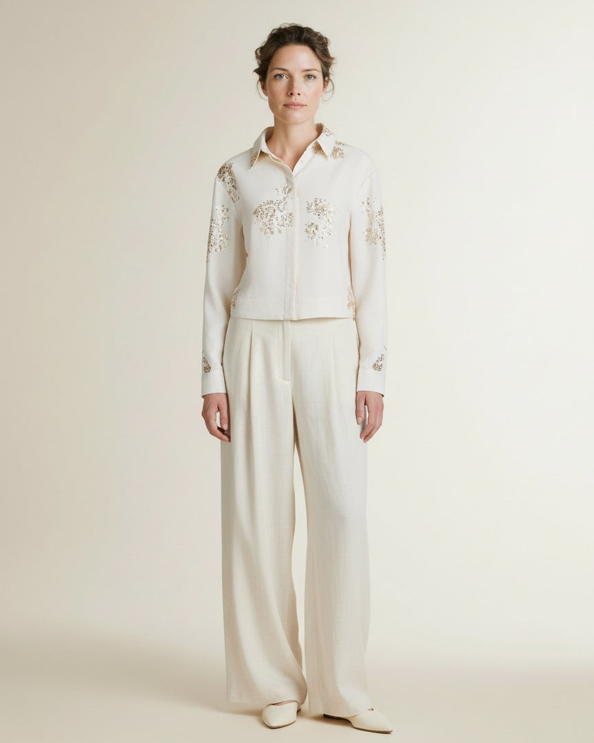 Full body view of the model wearing Nukus Adora Blouse Paillets 17 Off White