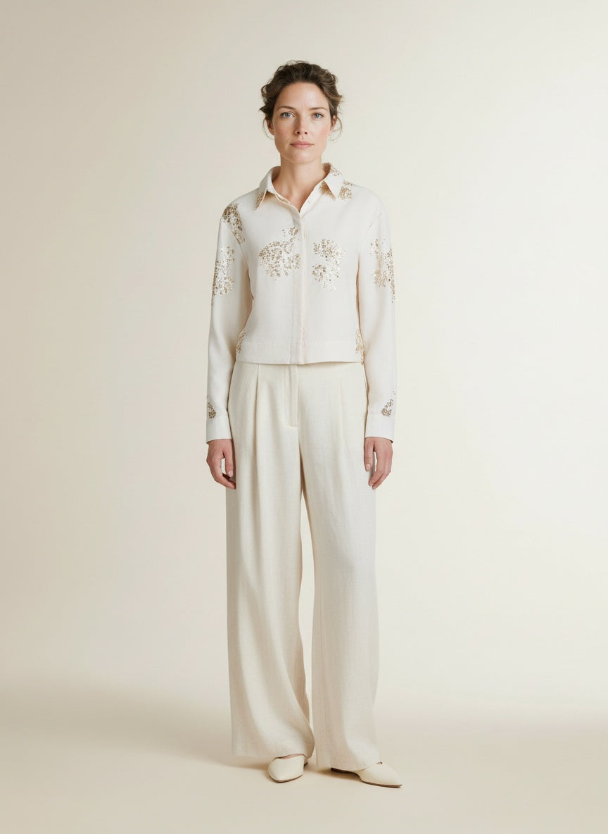 Full body view of the model wearing Nukus Adora Blouse Paillets 17 Off White