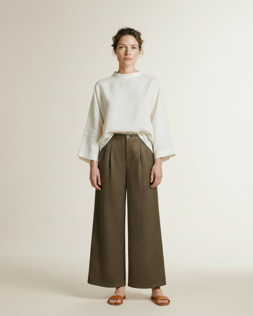 Full body view of the model wearing Nukus Bodine Pants Suede 319 Moss