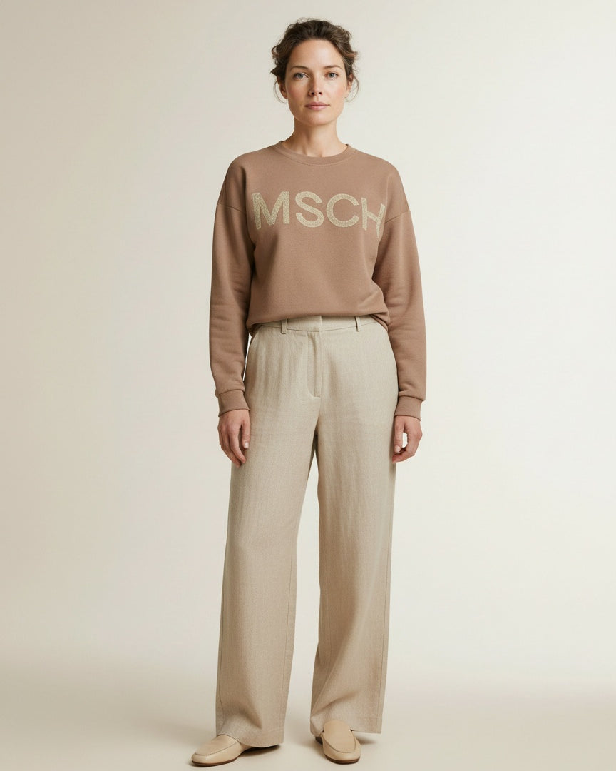 Full body view of the model wearing Msch Copenhagen Mschmela Briena Msch Sweatshir Mountain T Oatm