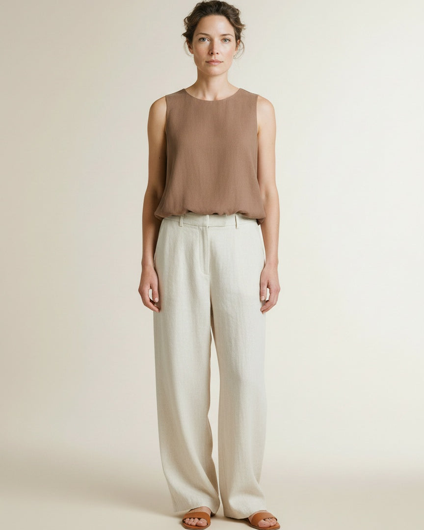 Full body view of the model wearing Yaya Sleeveless Woven Top With Balloon Hem Brownie Brown