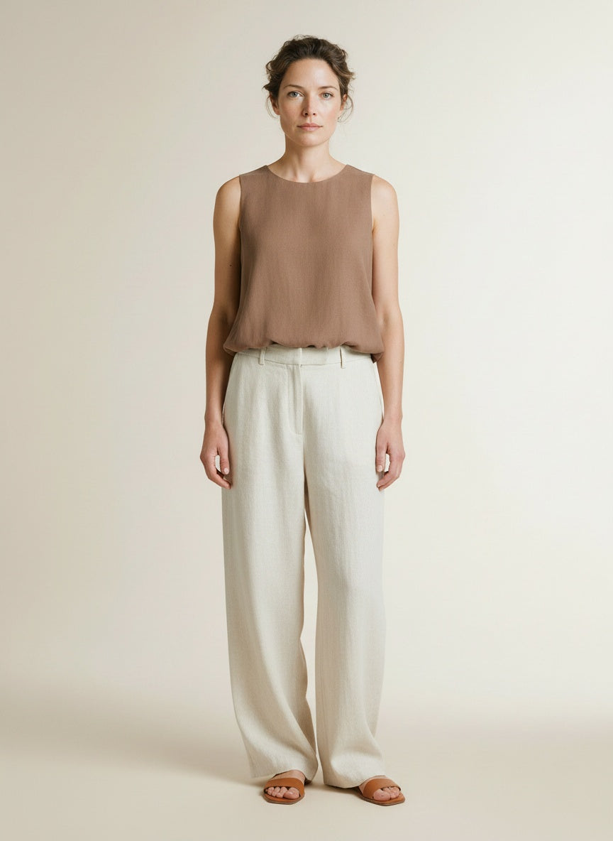 Full body view of the model wearing Yaya Sleeveless Woven Top With Balloon Hem Brownie Brown