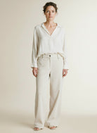 Full body view of the model wearing Mac Palazzo Jeans White Sand