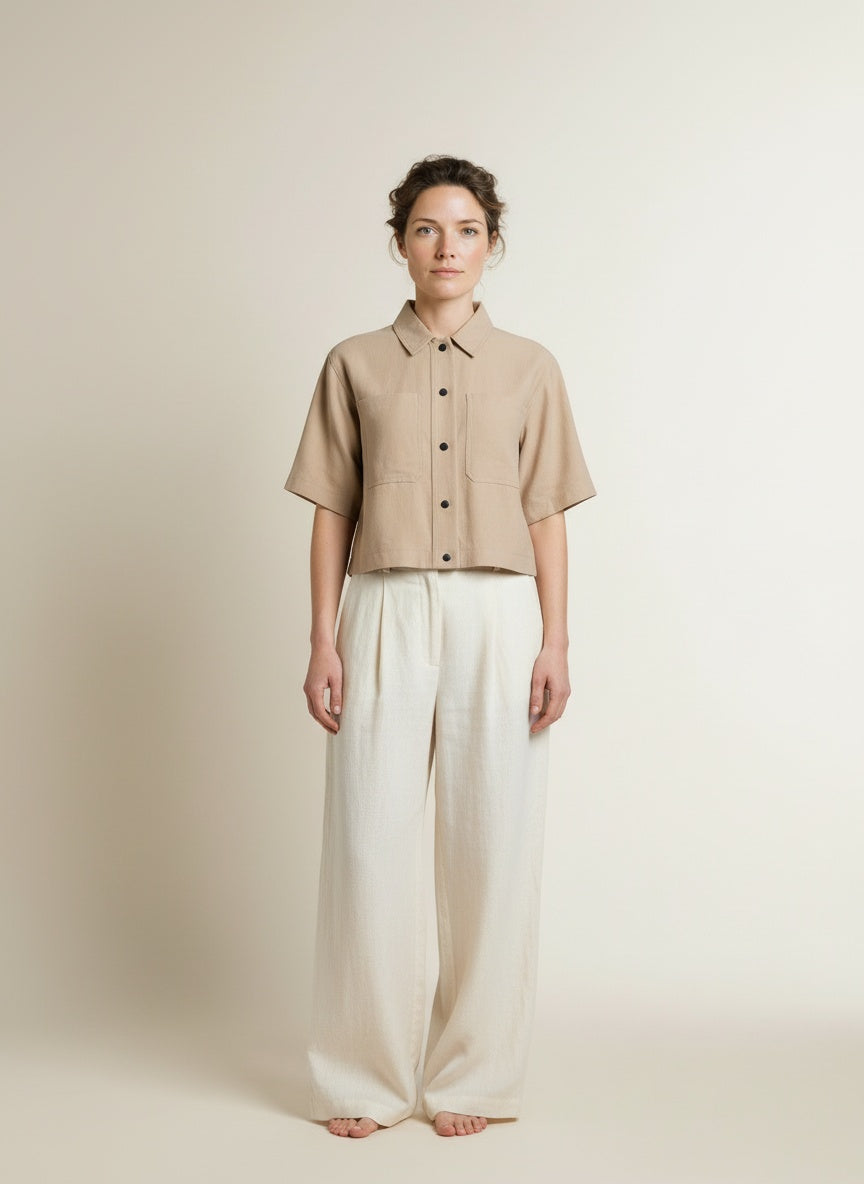 Full body view of the model wearing Aaiko Vanessa Ray 560 Blouses Sand