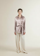 Full body view of the model wearing Nukus Amy Blouse Lace 9 Sand