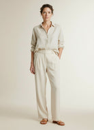 Full body view of the model wearing Yaya Woven Trousers With Wide Legs L32 Cloud Creme White