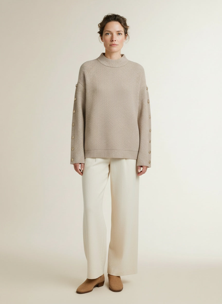 Full body view of the model wearing Co'couture Rowcc Button Sleeve Knit Bone