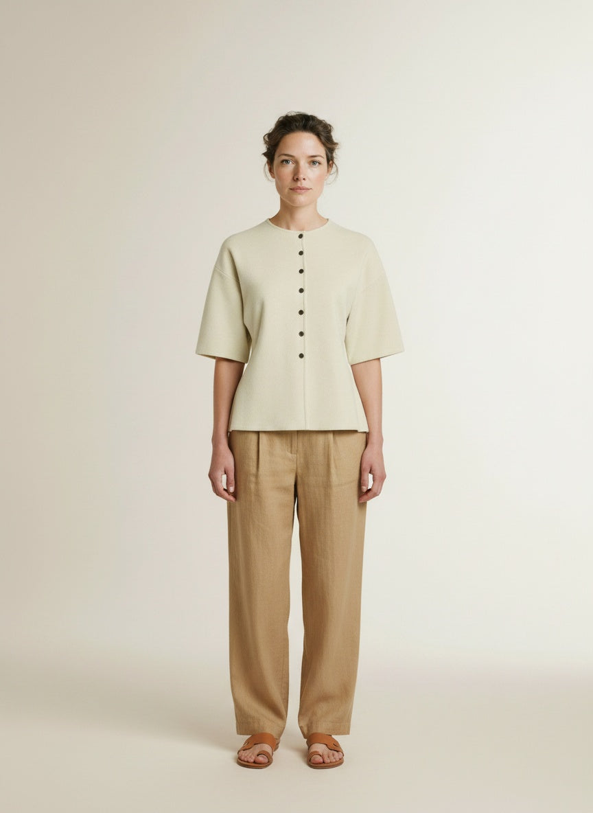 Full body view of the model wearing Msch Copenhagen Mschmirielle East 2 4 Cardigan Bleached Sand