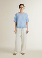 Full body view of the model wearing Red Button Skyler Linen/visc Pinstripe Light Blue