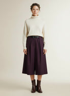 Full body view of the model wearing Copenhagen Muse Cmtailor Pants Bermuda Plum Perfect Melange