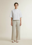 Full body view of the model wearing Co'couture Elaracc Ss Shirt White
