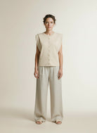 Full body view of the model wearing Yaya Sleeveless Cardigan Shoulder Detail Cloud Creme White