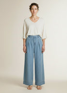 Full body view of the model wearing Co'couture Tillycc Pleat Ll Pant Fade Denim