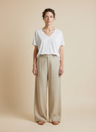 Full body view of the model wearing Msch Copenhagen Mschfenya Modal V Neck Tee Bright White