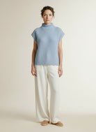 Full body view of the model wearing Co'couture Rainacc Knit Vest Pale Blue