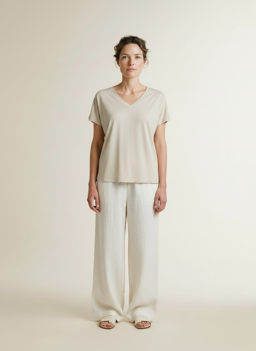 Full body view of the model wearing Msch Copenhagen Mschfenya Modal V Neck Tee Oatmeal