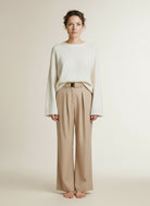 Full body view of the model wearing Aaiko Lotty Fringed Ray 560 Trousers Sand