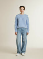 Full body view of the model wearing Msch Copenhagen Mschmiabelle Hope Pullover Emb Windsurfer Flwr