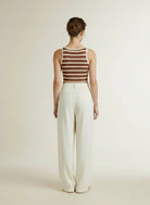 Back pose of the model wearing Co'couture Grannycc Rib Emb. Tank Top Offwhite/suntan