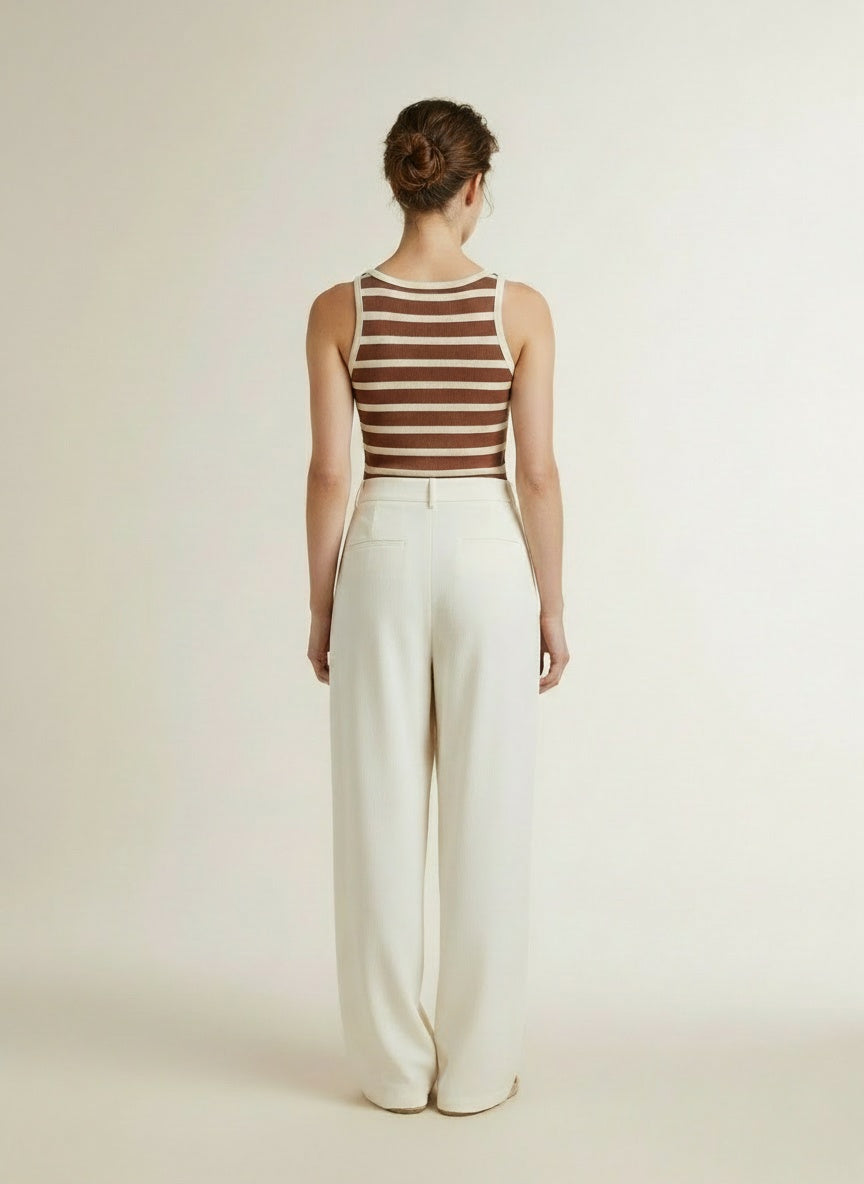 Back pose of the model wearing Co'couture Grannycc Rib Emb. Tank Top Offwhite/suntan
