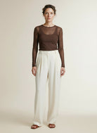 Full body view of the model wearing Co'couture 33201 Meshcc O-neck Blouse Brown
