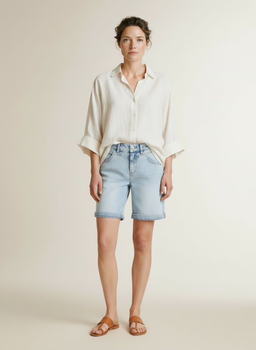 Full body view of the model wearing Red Button Kate Short Light Bleach