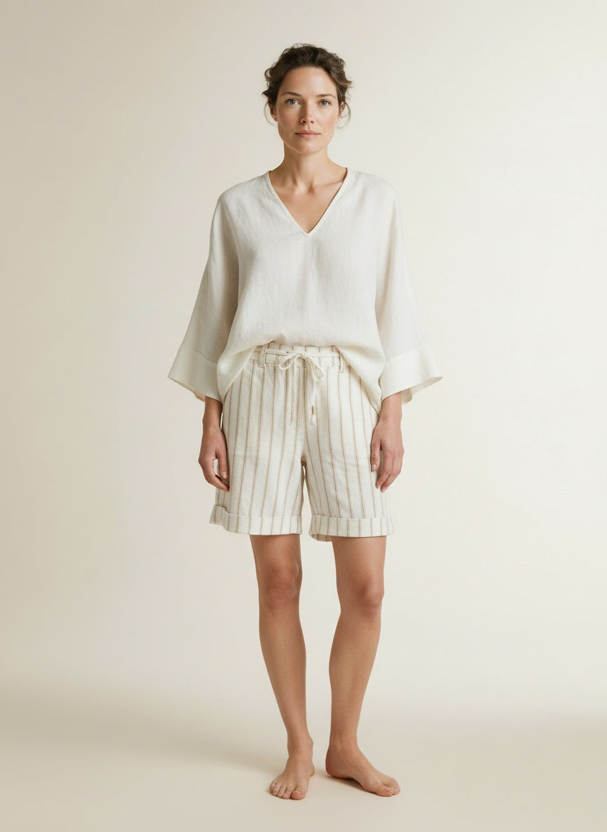 Full body view of the model wearing Red Button Camille Short Linen/co Stripe Dark Sand