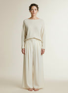 Full body view of the model wearing Co'couture Auracc Skirt Ll Pant Off White