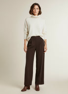 Full body view of the model wearing Co'couture Esticc Pleat Pant Bison L34