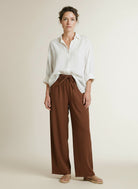 Full body view of the model wearing Co'couture Elaracc Ll Pant Suntan