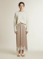 Full body view of the model wearing Co'couture Iduncc Lace Skirt Bisquit