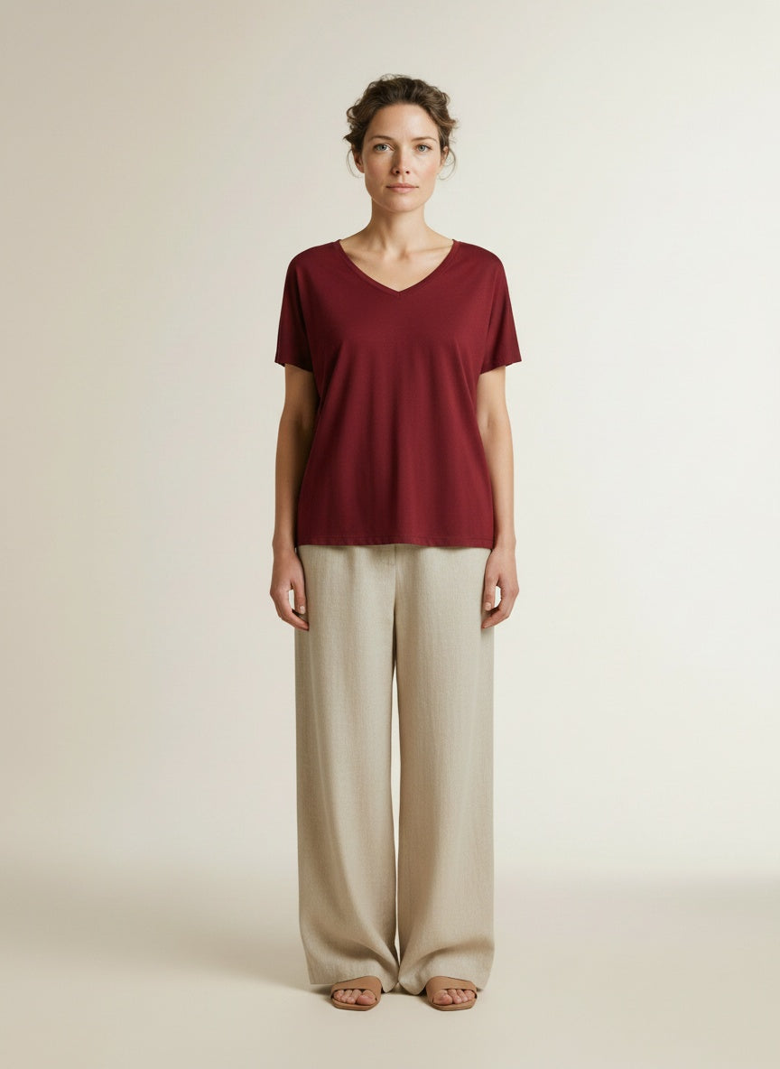 Full body view of the model wearing Msch Copenhagen Mschfenya Modal V Neck Tee Rhubarb