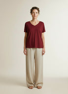 Full body view of the model wearing Msch Copenhagen Mschfenya Modal V Neck Tee Rhubarb