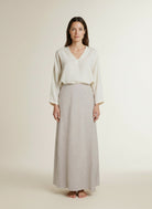 Full body view of the model wearing Msch Copenhagen Mschviana Ginia Skirt Sand Melange
