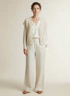 Full body view of the model wearing Red Button Sleeveless Fuzzy Cream